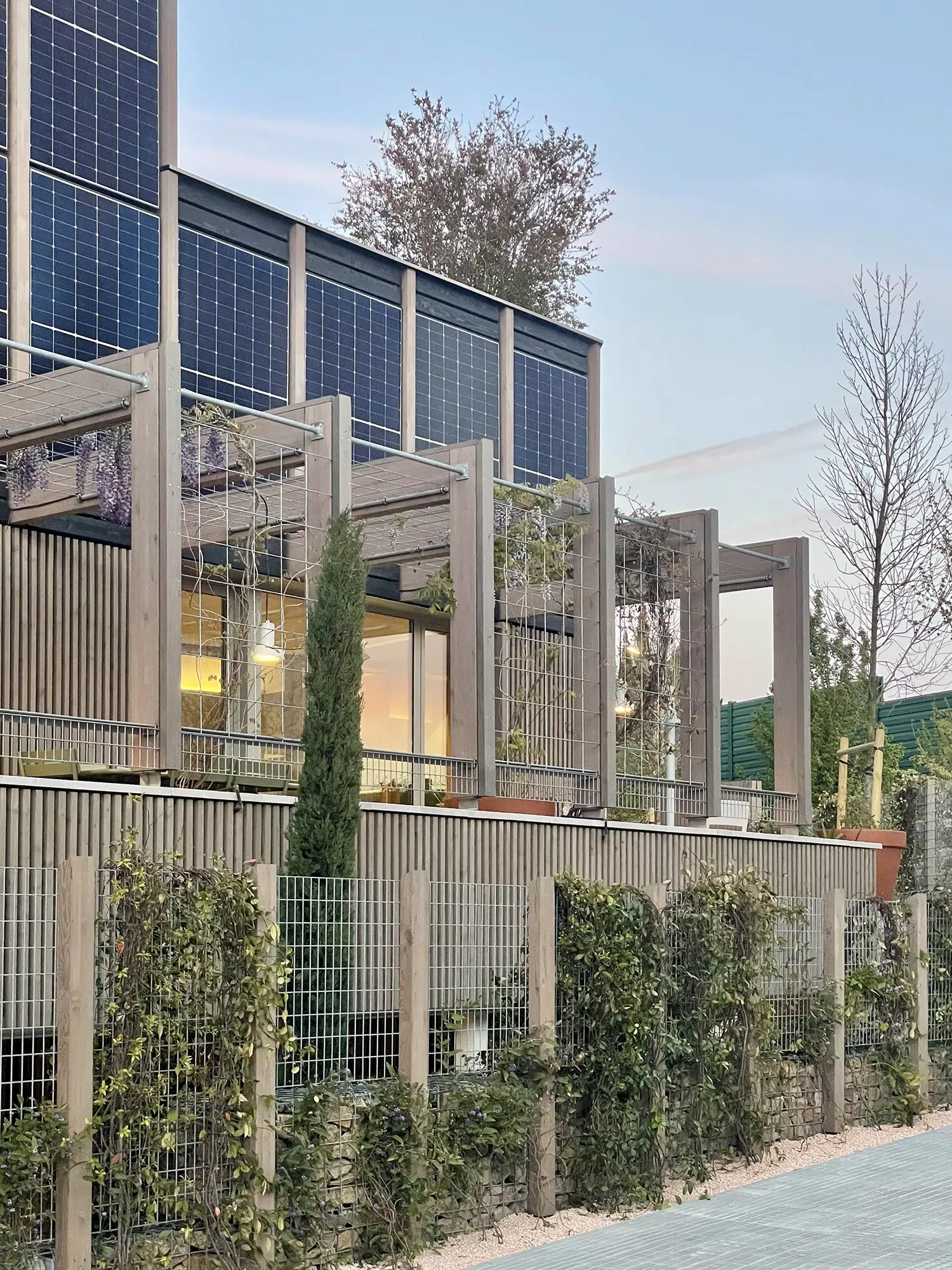 The MF01 support asset is a mixed-use complex of offices and housing with a timber structure, incorporating innovations in sustainability, energy efficiency, and workplace well-being.
